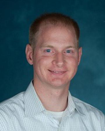A headshot of Professor Clemens