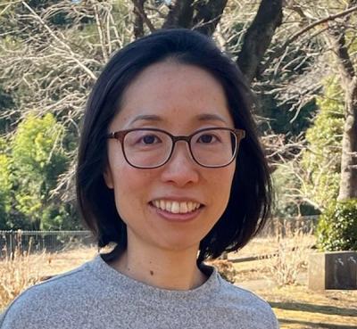 This is a photo of Dr. Tomoko Harigaya, Chief Economist and Director of Research at Precision Development.