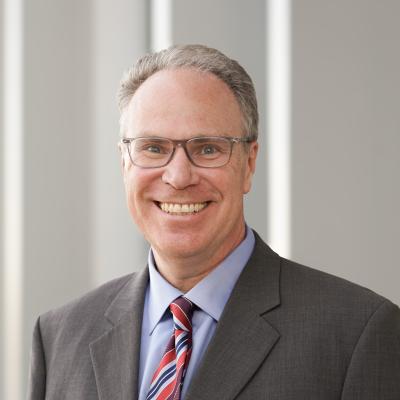 Headshot of Tom DeLeire
