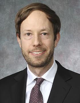 Headshot of Raphael Schoenle