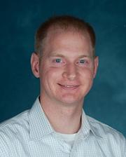 A headshot of Professor Clemens